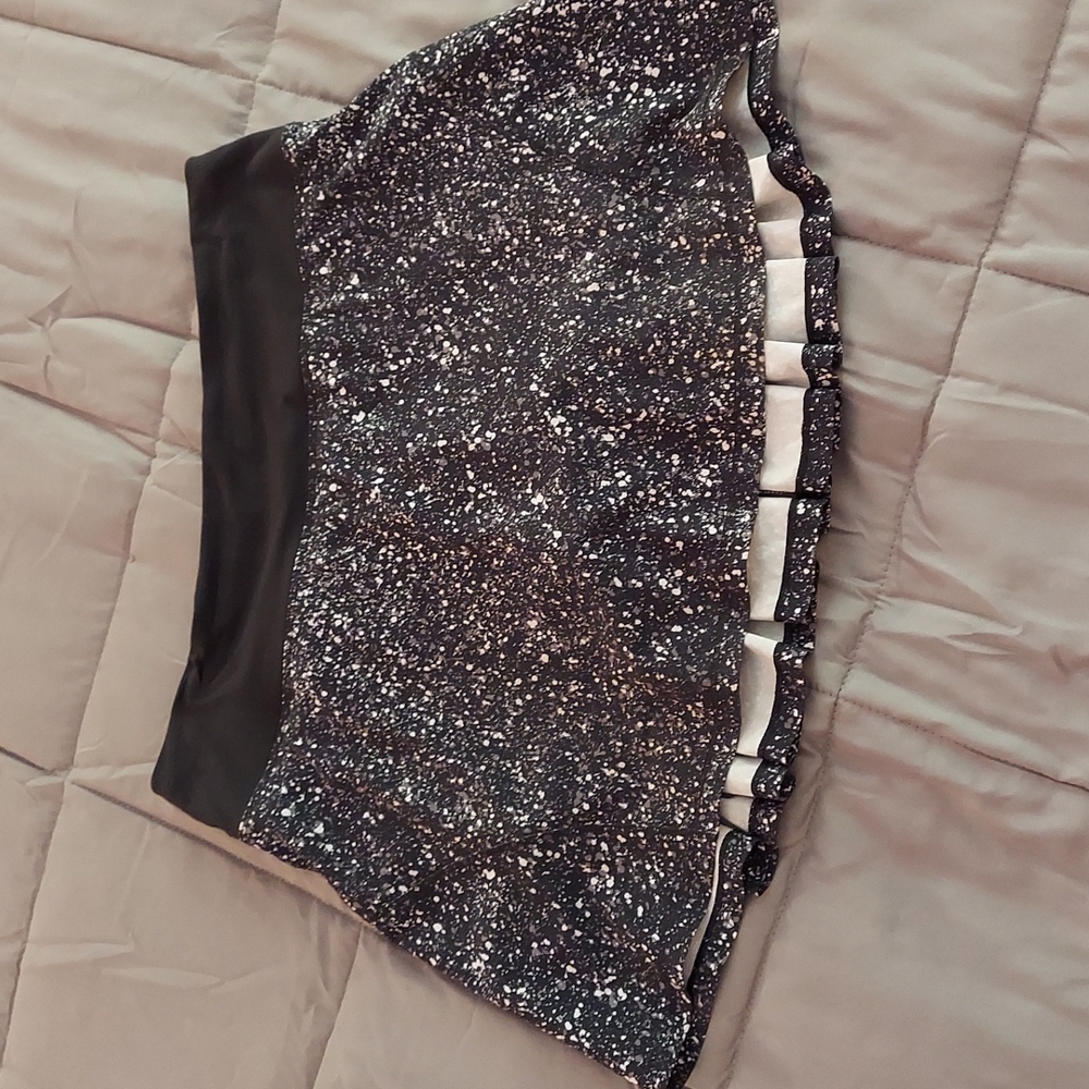 Lululemon black and white speckled skirt with black built in shorts.